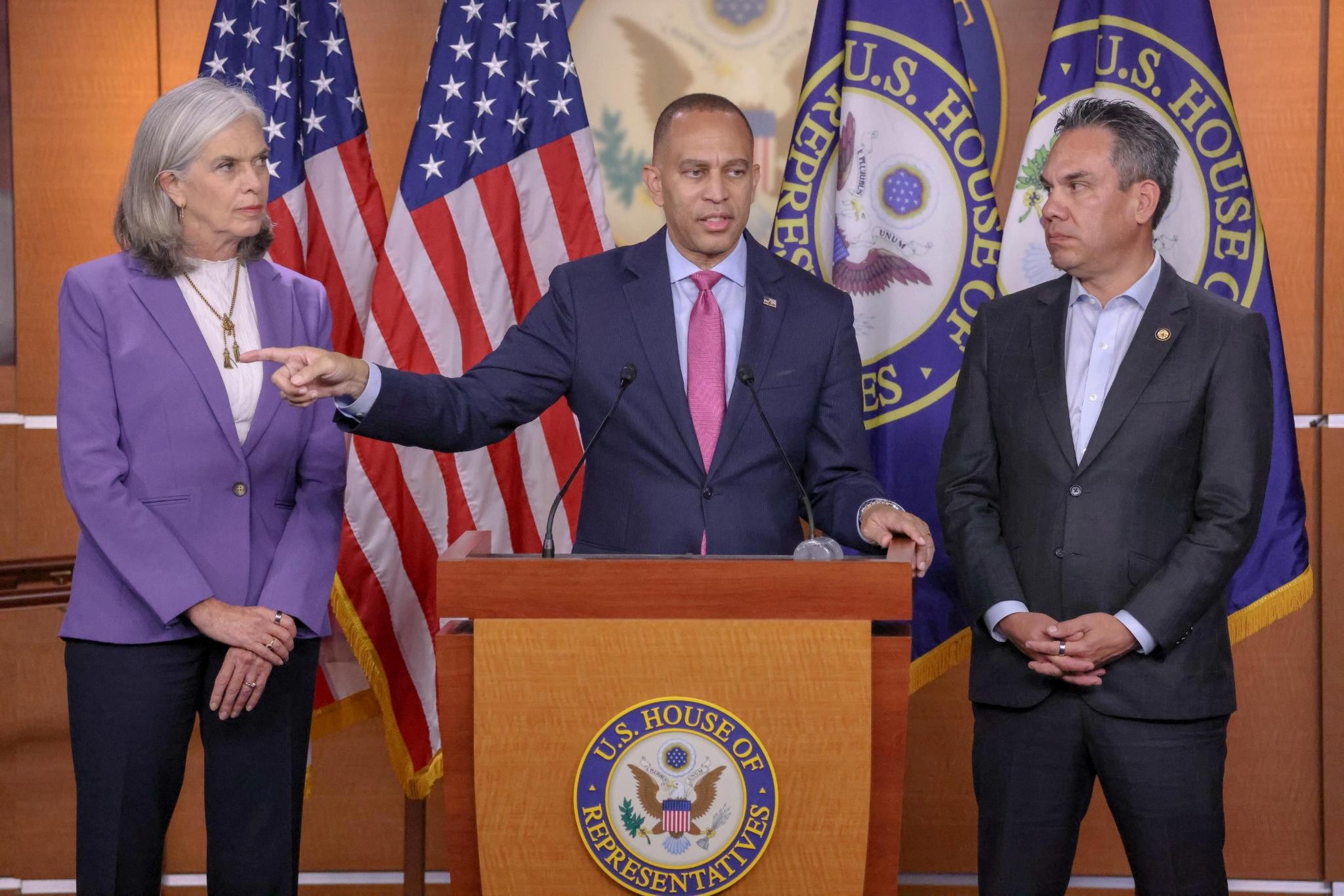 Leader Jeffries (center), Whip Katherine Clark (left) and Chair Pete Aguilar (right) at press conference