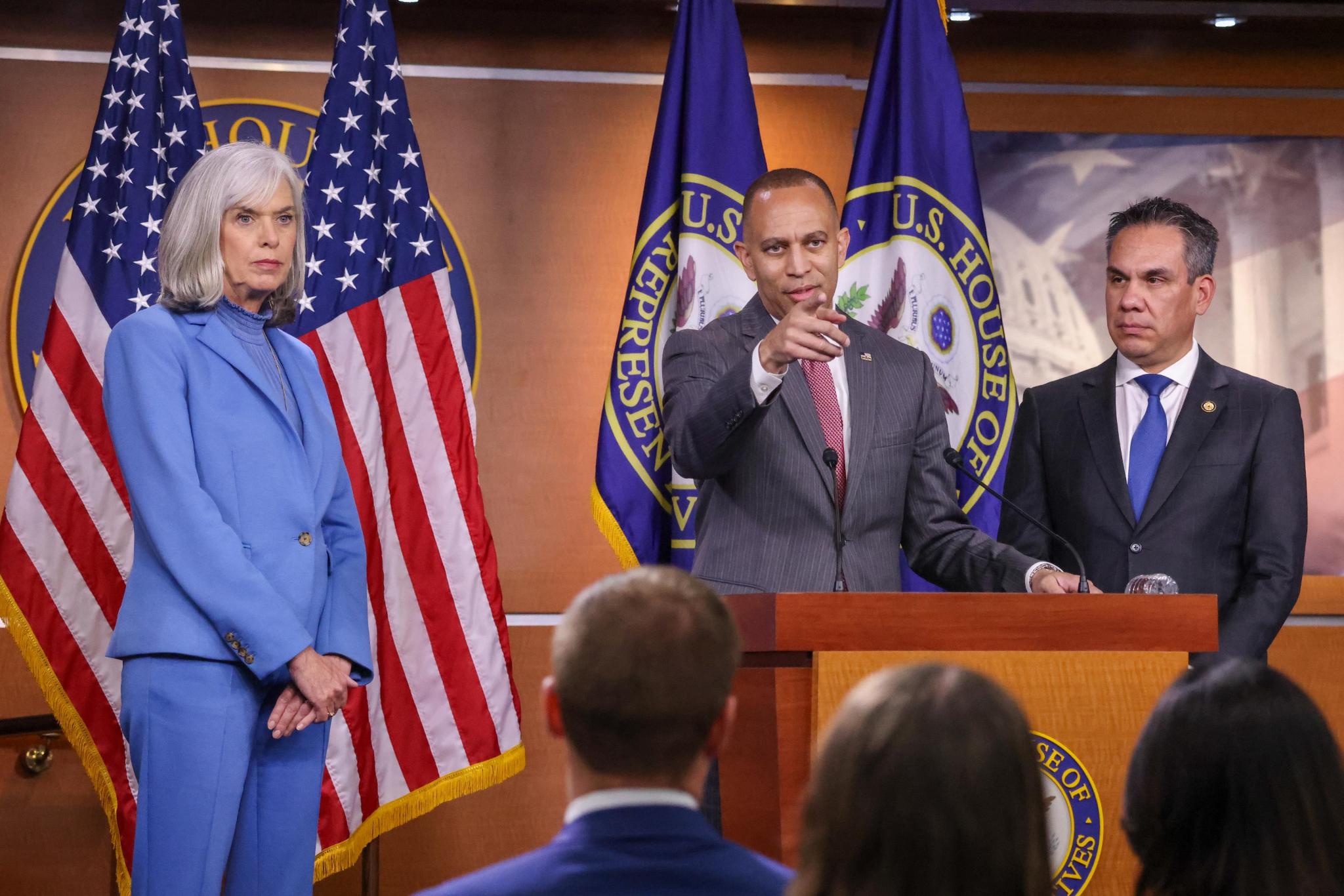 Leader Jeffries (center), Whip Katherine Clark (left) and Chair Pete Aguilar (right) at press conference