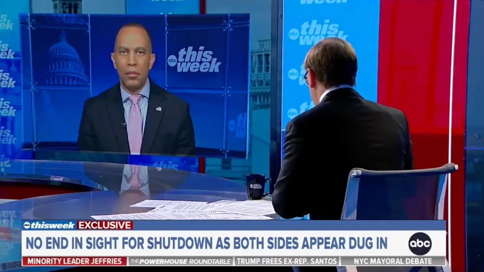 Leader Jeffries (right) and Jonathan Karl (left) appearing on screen