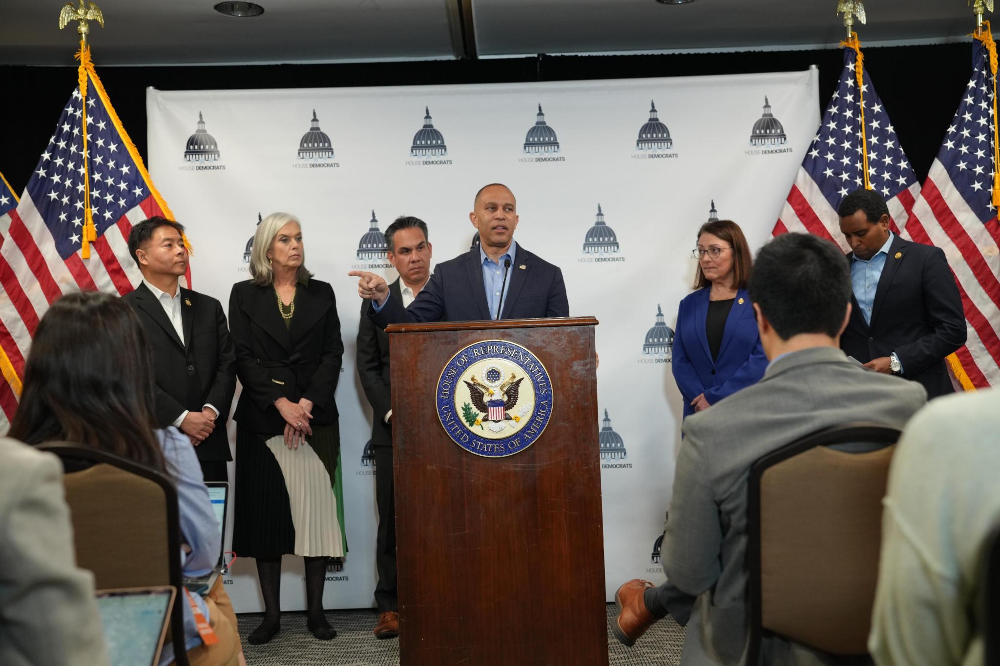 (from left) Vice Chair Ted Lieu, Whip Katherine Clark, Chair Pete Aguilar, Leader Hakeem Jeffries, DCCC Chair Suzan DelBene, Assistant Leader Joe Neguse all speaking at press conference