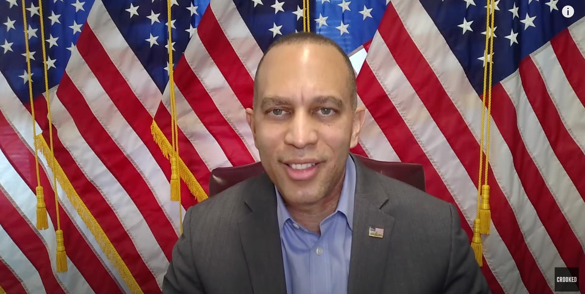 Leader Jeffries appearing on screen in front of five American flags