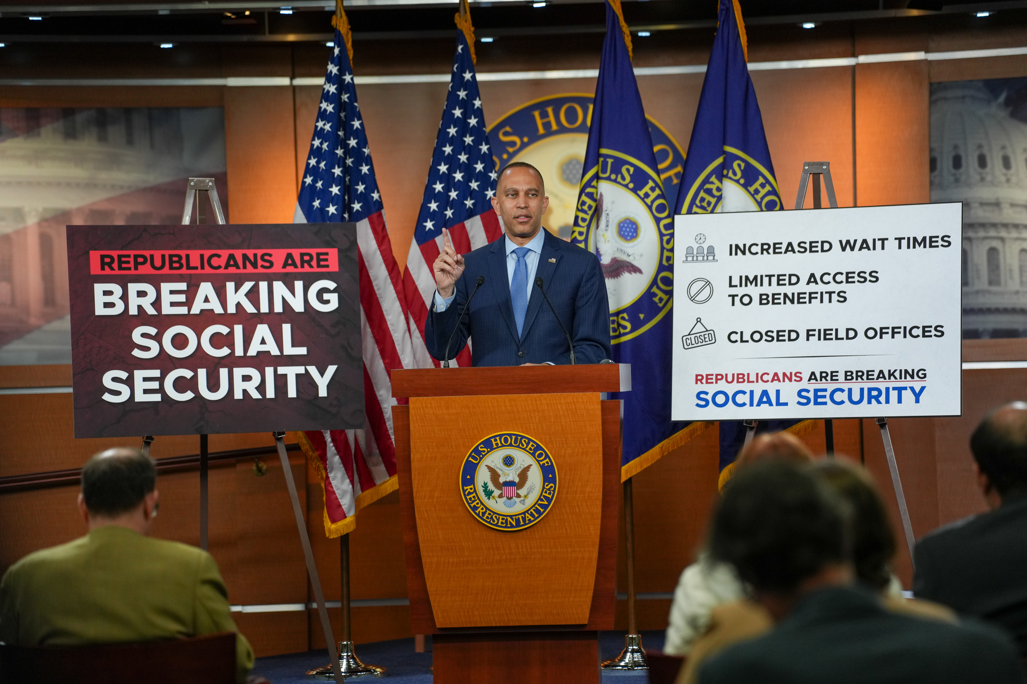 Leader Jeffries Speaking at Weekly Press Conference in between signs that read "Republicans are Breaking Social Security" and "Increased Wait Times, Limited Access to Benefits, Closed Field Offices. Republicans are Breaking Social Security"
