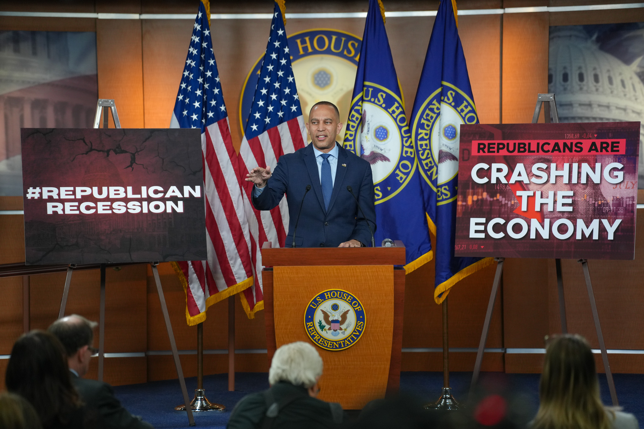 Leader Jeffries Speaking at Weekly Press Conference in between signs reading "Republican Recession" and "Republicans are crashing the economy"
