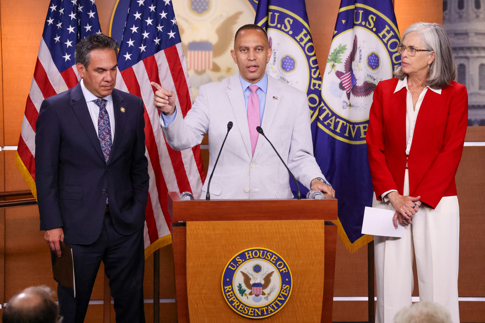 Leader Jeffries (center), Whip Katherine Clark (right) and Chair Pete Aguilar (left) at press conference