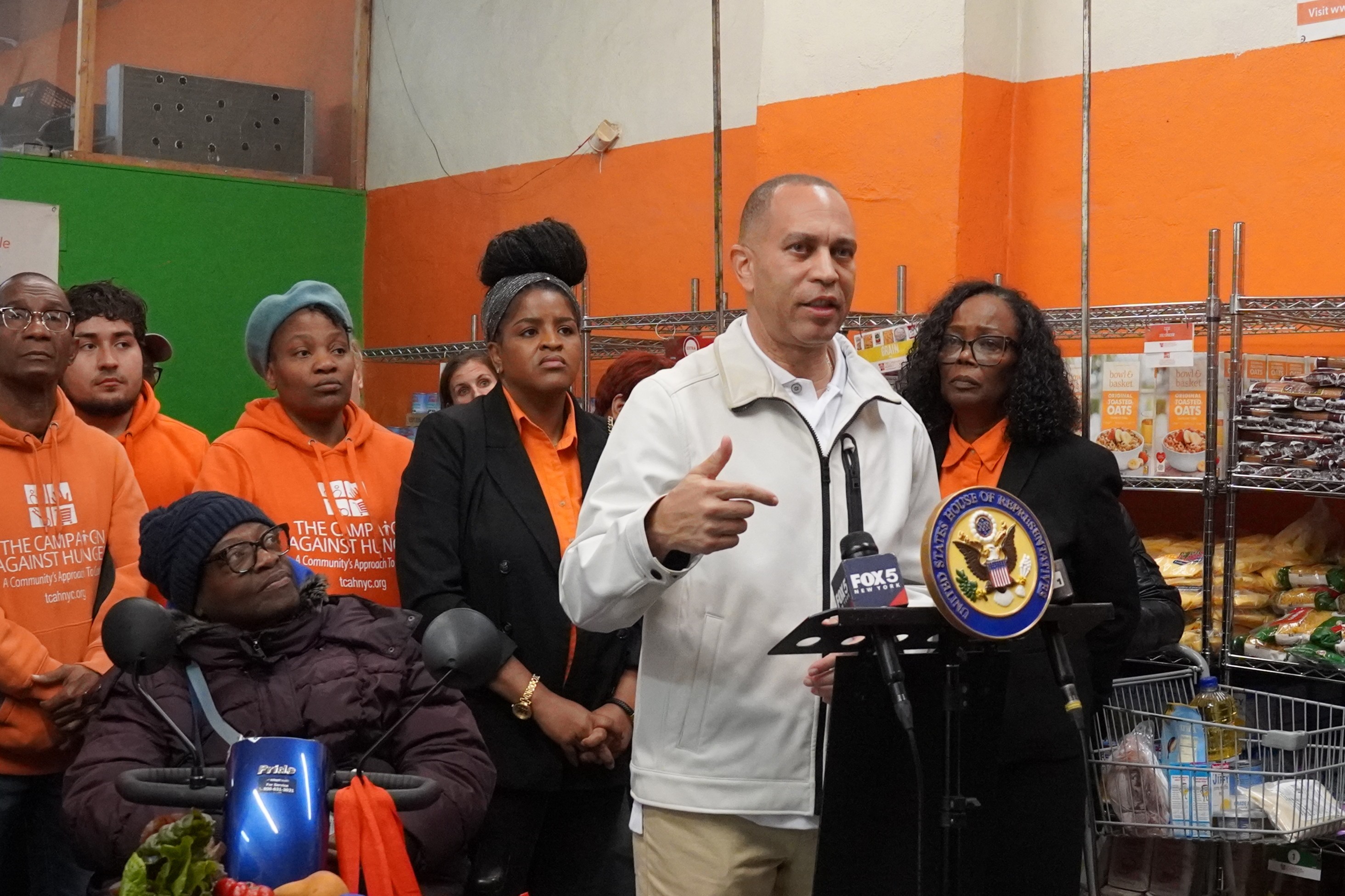 Leader Jeffries speaking in front of staff from The Campaign Against Hunger inside the location's food pantry