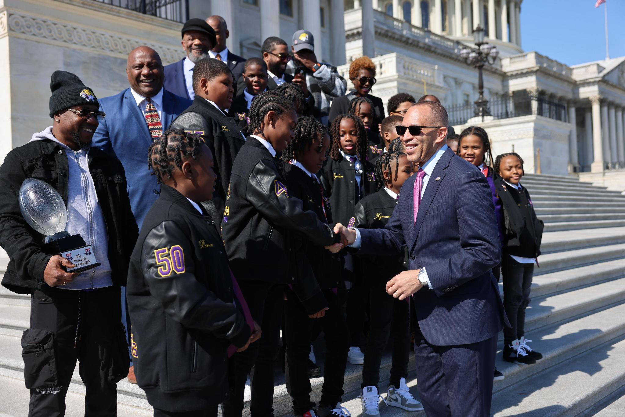 Leader Jeffries on House steps meeting members of the Mo Better Jaguars football team