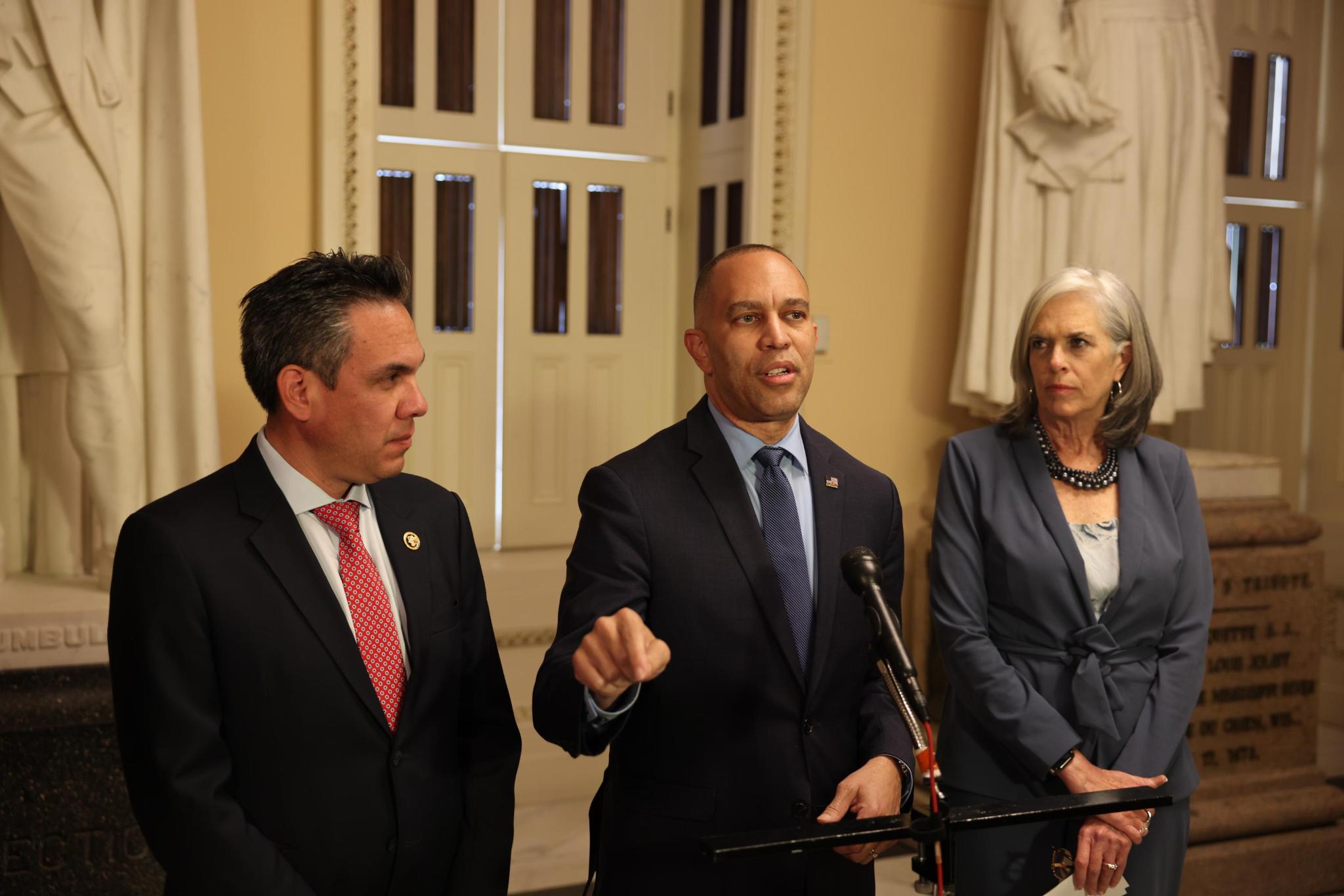 Leader Jeffries (center), Whip Katherine Clark (right) and Chair Pete Aguilar (left) at press conference