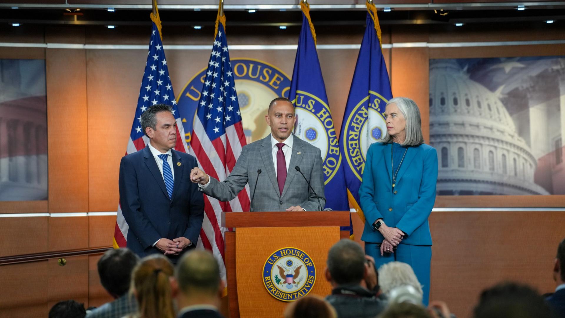 Leader Jeffries (center), Whip Katherine Clark (right) and Chair Pete Aguilar (left) at press conference