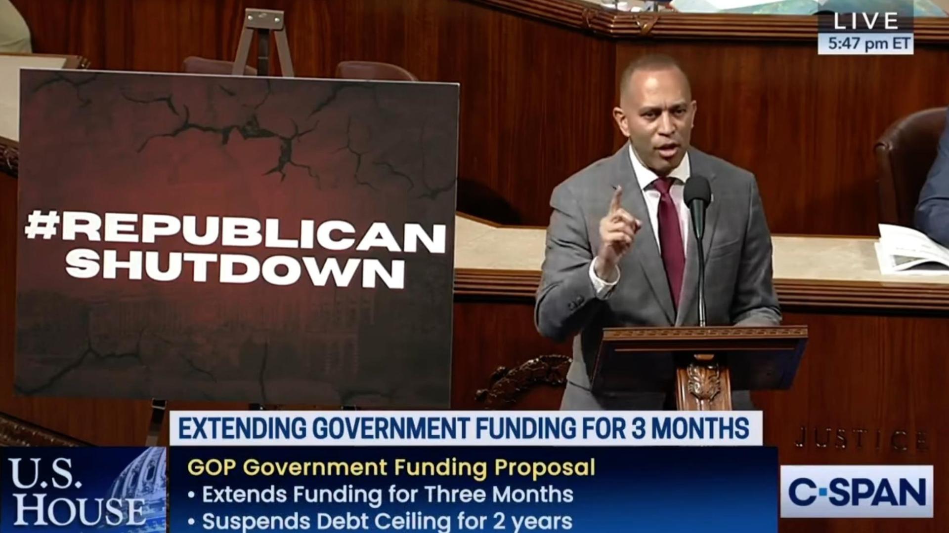 Leader Jeffries speaking on the House Floor with a poster reading #Republican Shutdown