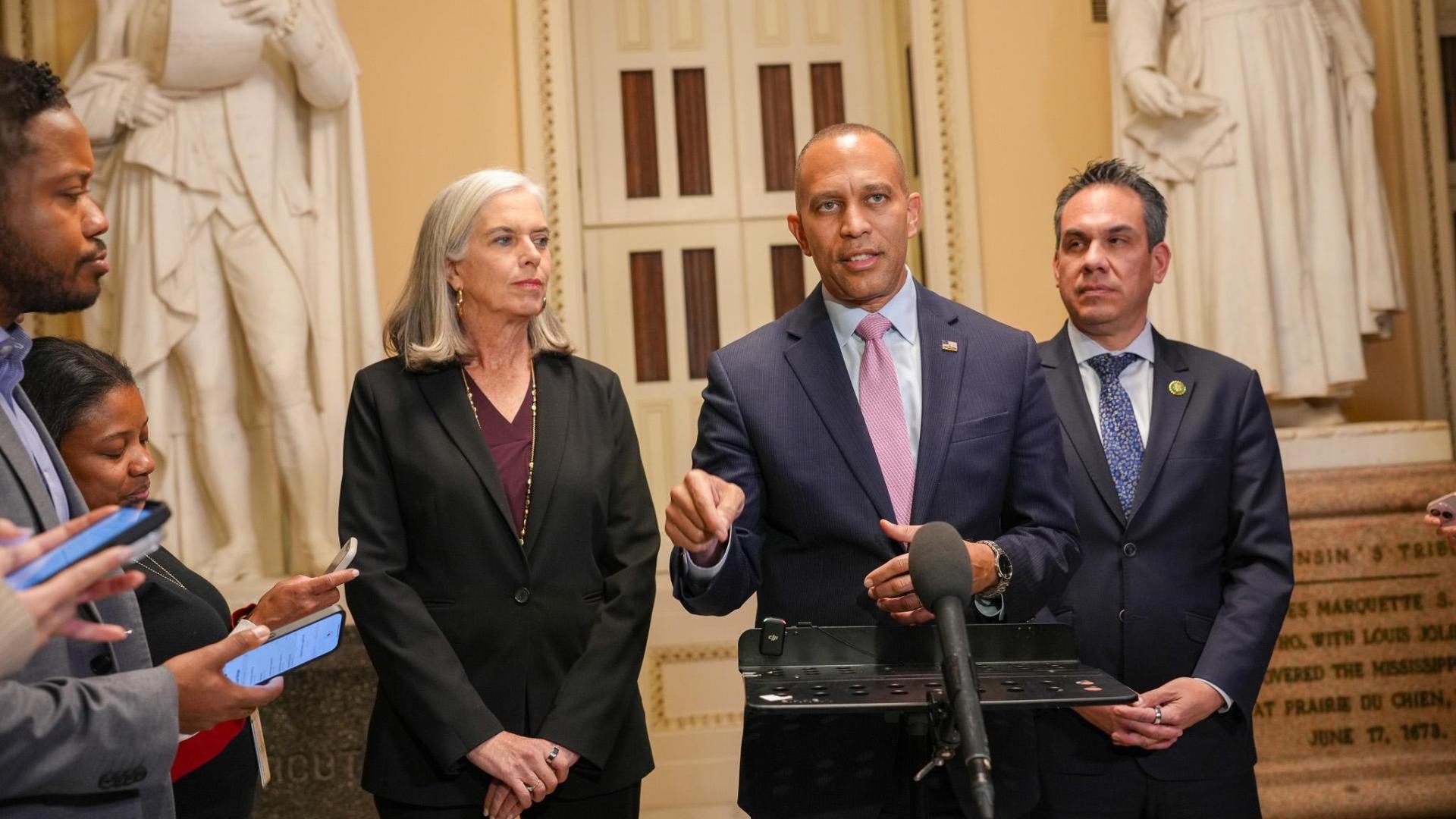 Leader Jeffries (center), Whip Katherine Clark (left) and Chair Pete Aguilar at press conference