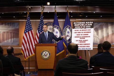 Leader Jeffries Speaking at Weekly Press Conference with a poster outlining the extreme MAGA Republican agenda