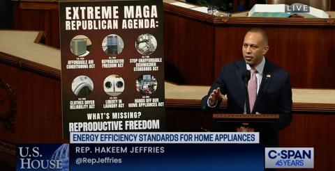 Leader Jeffries speaking on the House Floor with a poster referencing House Republicans' planned appliance bills