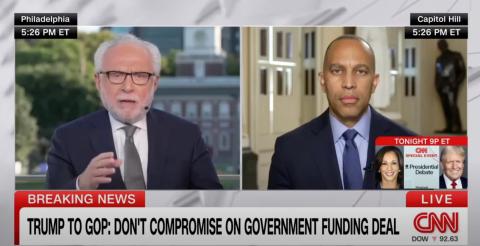 Wolf Blitzer (left) and Leader Jeffries (right) appearing on screen