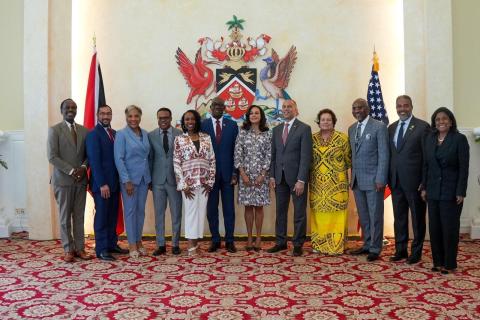 Members of the Congressional Delegation to Trinidad and Tobago pose for a group photo with PM Keith Rowley