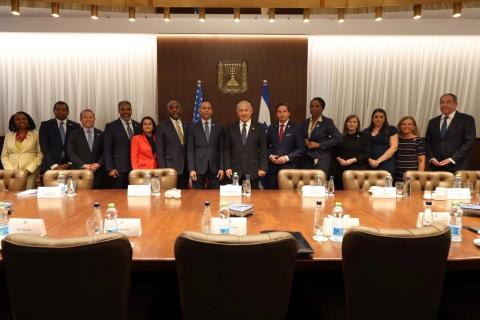 Members of the Congressional Delegation Posing for Photo with PM Benjamin Netanyahu. From left: Rep. Yvette Clarke, Rep. Joe Neguse, Rep. Josh Gottheimer, Rep. Steven Horsford, Rep. Nanette Barragán, Chairman Gregory Meeks, Leader Hakeem Jeffries, Israeli PM Benjamin Netanyahu, Rep. Dean Phillips, Rep. Stacey Plaskett, Rep. Lizzie Fletcher, Rep. Sara Jacobs, Rep. Debbie Wasserman Schultz, US Ambassador to Israel Thomas Nides