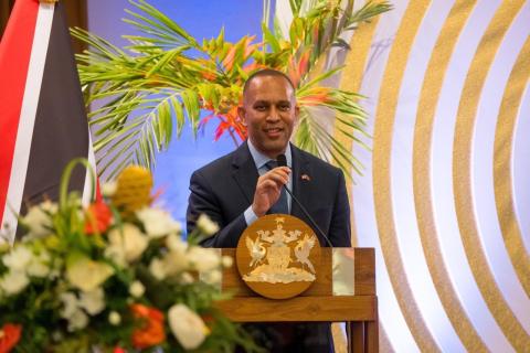 Leader Jeffries speaking at podium in Trinidad and Tobago